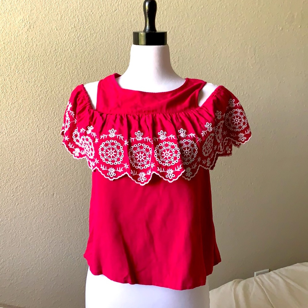Off shoulder magenta top.